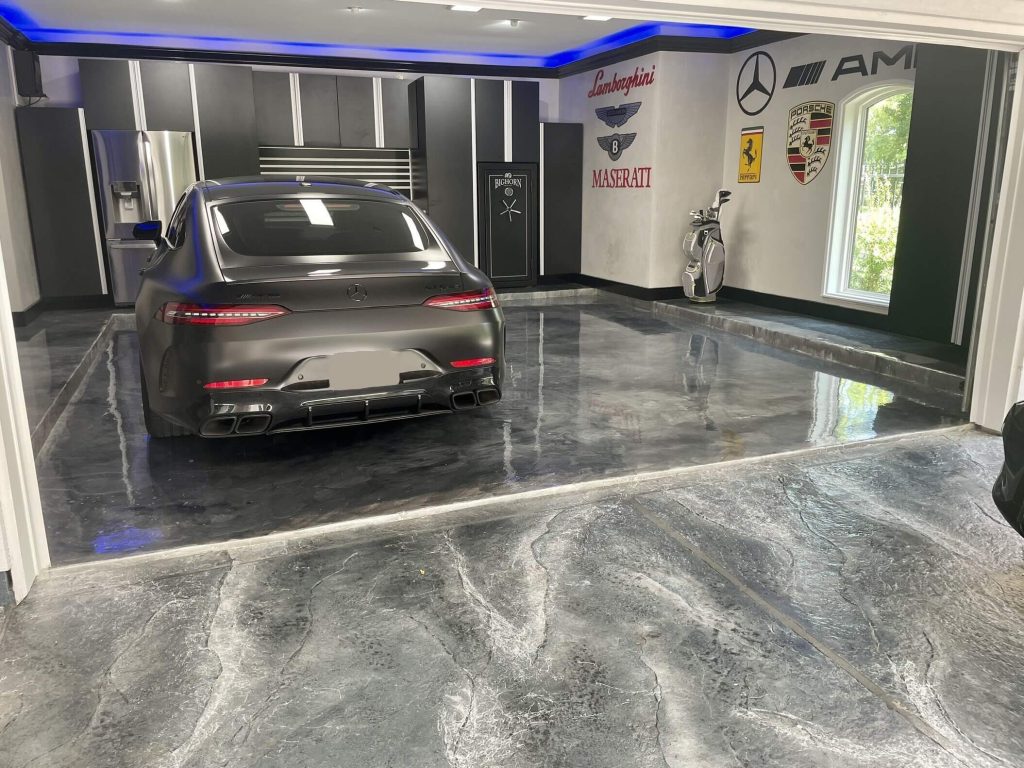 Sleek car parked in a glossy garage with luxury brand logos on the wall and golf clubs in the corner.